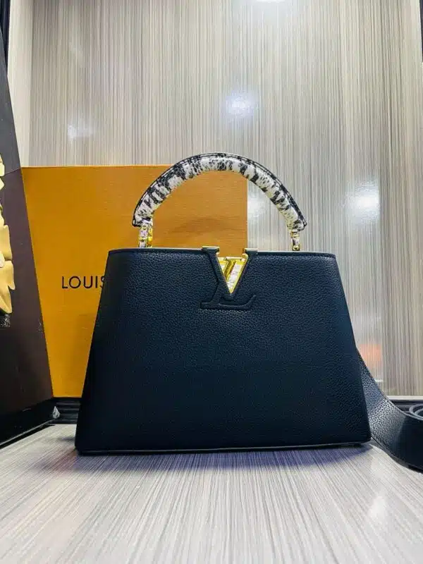 lv leather capucines hand bag.