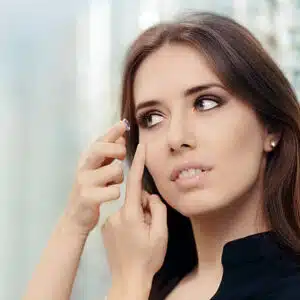 Close up of a girl trying on beauty medical contact lenses