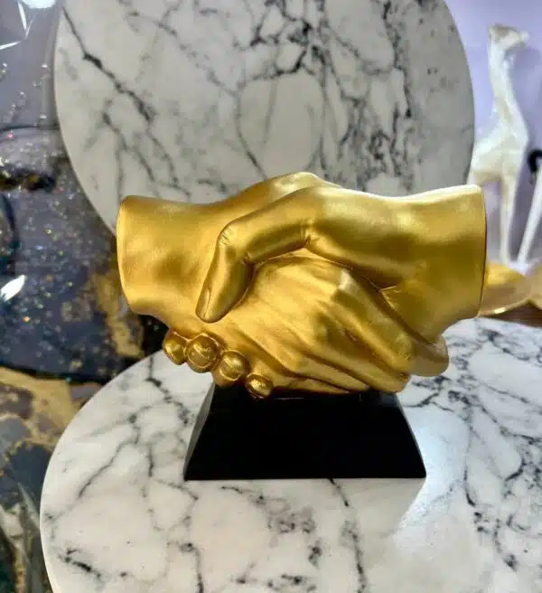 golden handshake figurine