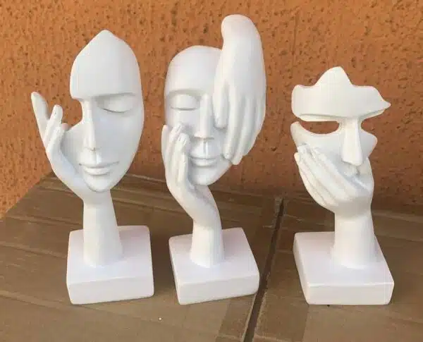 white face & hand figurine decor
