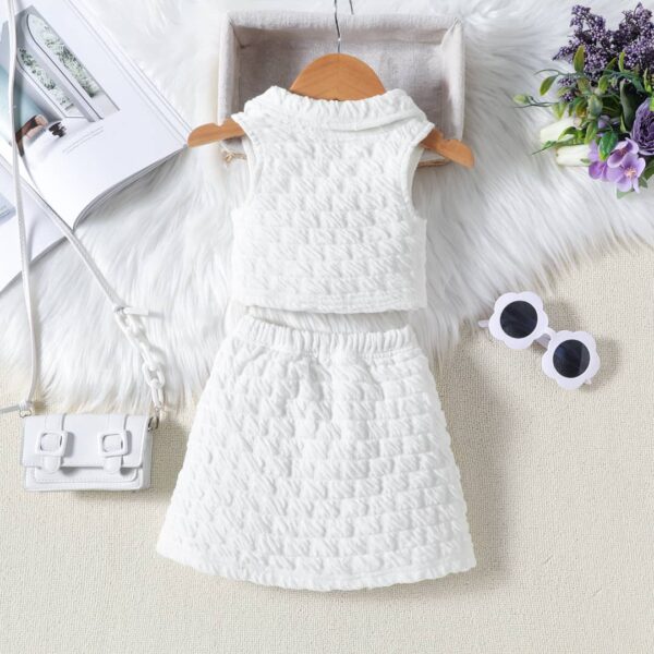 little girl's crop top and short skirt set