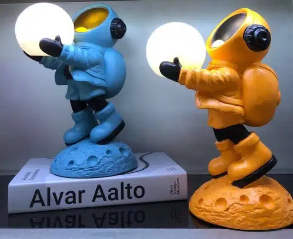 astronaut with moon light figurine