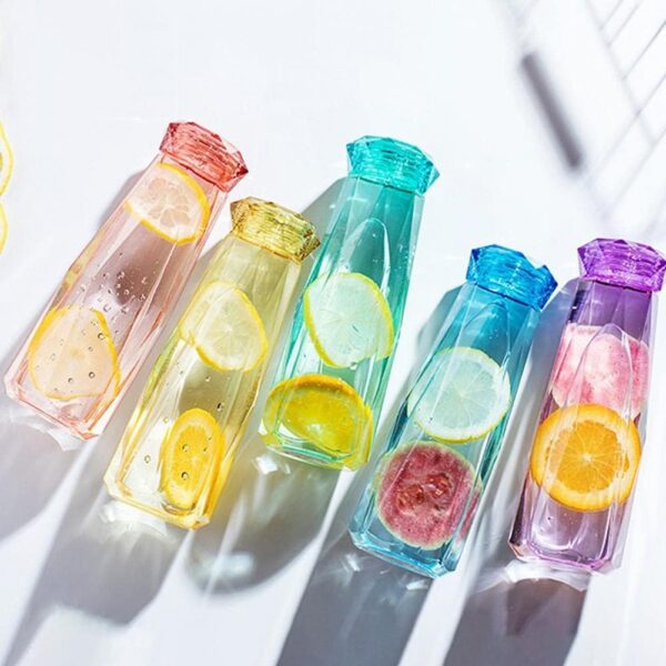 transparent glass water bottle