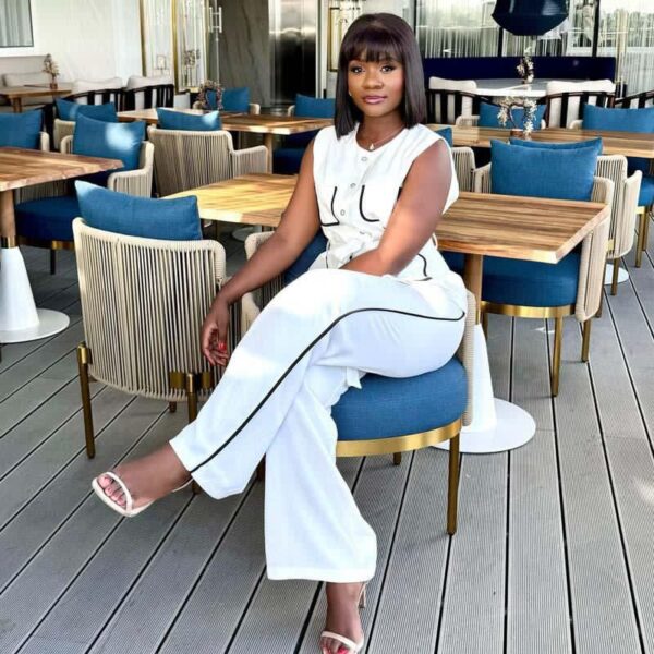 women's white sleeveless shirt and pant suit