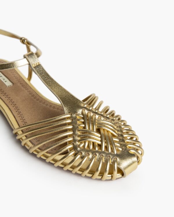 gold flat woven sandal