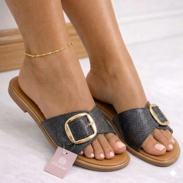 women buckled open-toe slippers