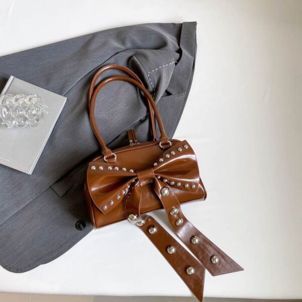 studded bow accent luxe bag